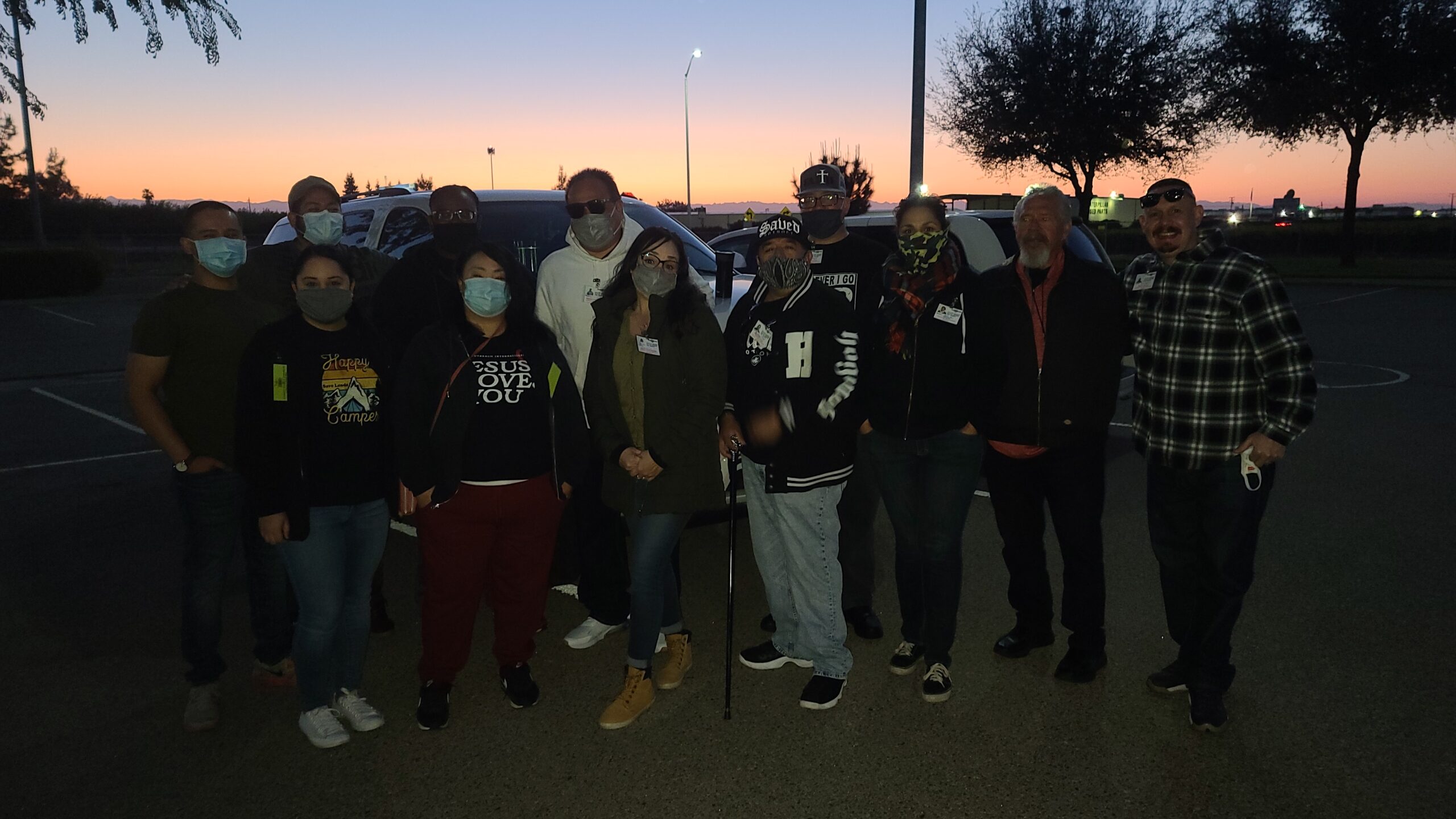 Loto ministries group text outside in parking lot